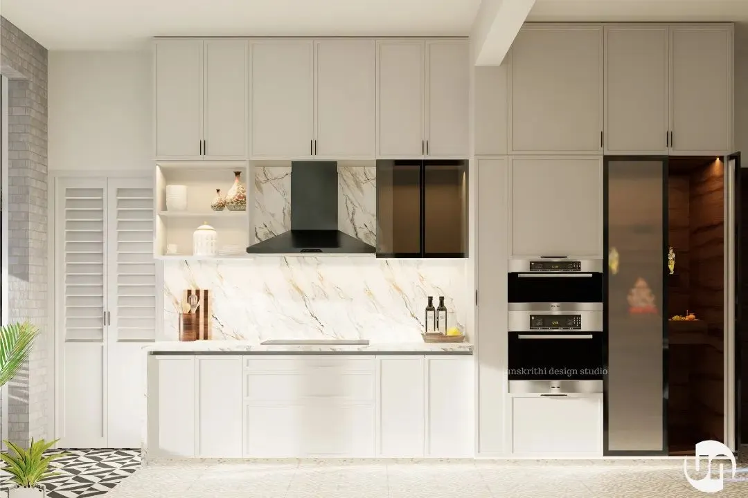 This kitchen was a complete transformation. The goal was to make it bright, airy, and timeless. By removing walls and redesigning the cabinetry with clean, classical lines and a marble backsplash, we created a functional, open-plan kitchen that feels both spacious and elegant, perfectly aligning with the client's taste.