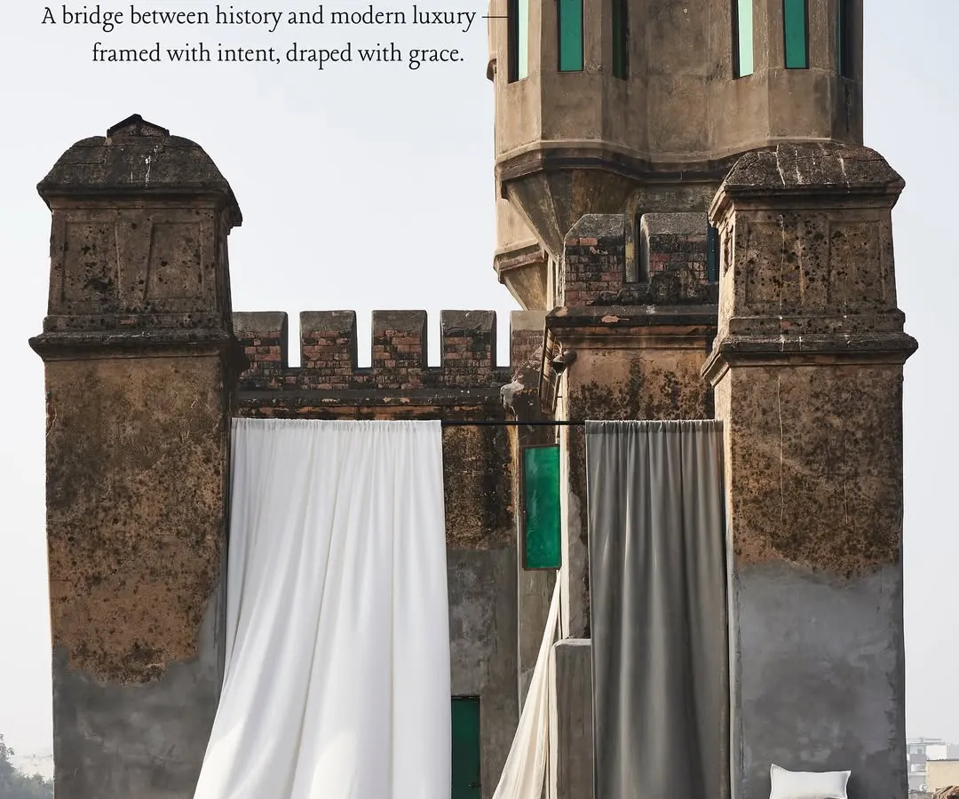 I believe fabric is poetry in motion. Here, we juxtaposed modern luxury drapes against the raw texture of a historic Indian fort, creating a bridge between past and present. This image demonstrates my approach to telling a story through texture, light, and environment.