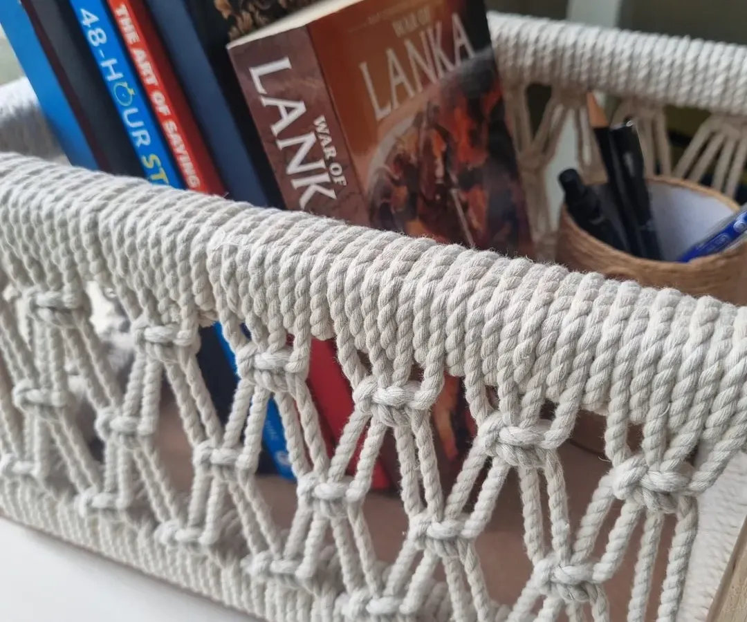 My multipurpose macrame baskets are where function meets beauty. This one, shown here holding books, is built on a sturdy wooden frame, making it perfect for organizing your essentials or creating a beautiful, personalized gift hamper.