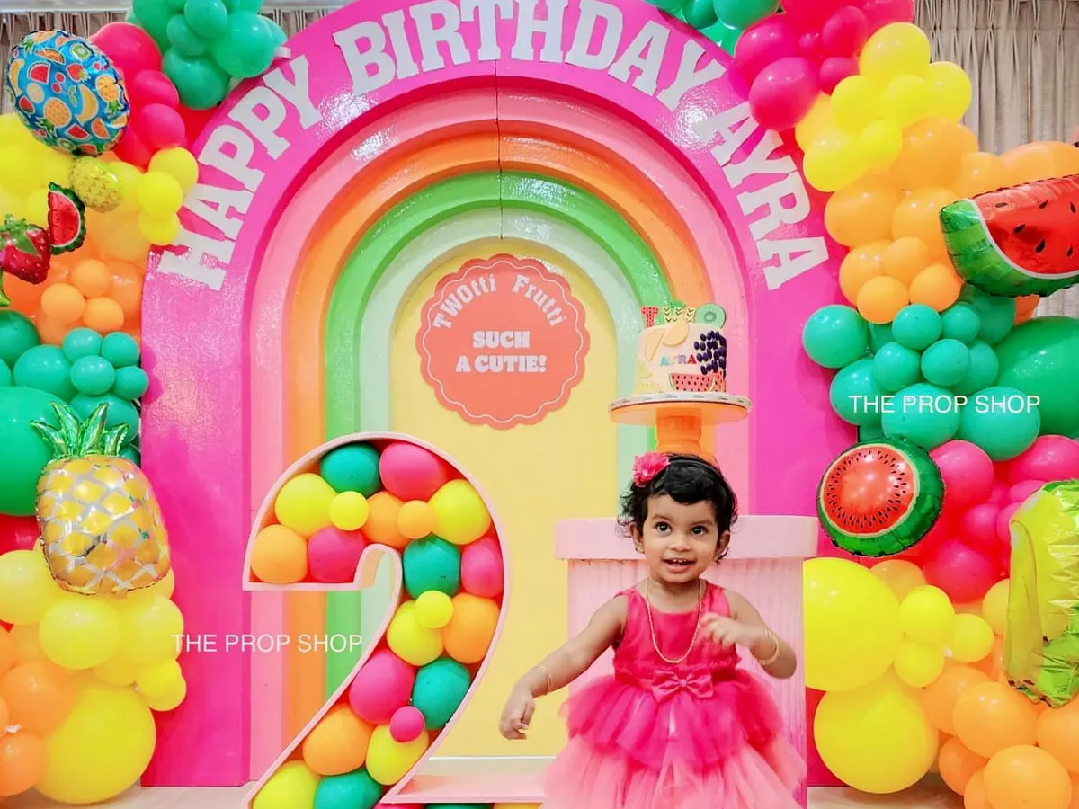 We love bringing vibrant themes to life, like this "Tutti Frutti" second birthday party. Our custom rainbow arch backdrop and balloon-filled number prop create a colorful and joyful centerpiece that kids and adults adore.