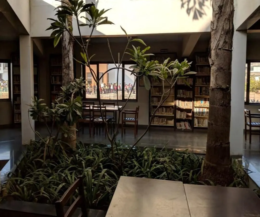 At the Vidyamandir School, we designed the library around an open-to-sky courtyard, bringing a small garden directly into the heart of the learning space. This integration of nature creates a tranquil and stimulating environment for students, promoting focus and well-being.