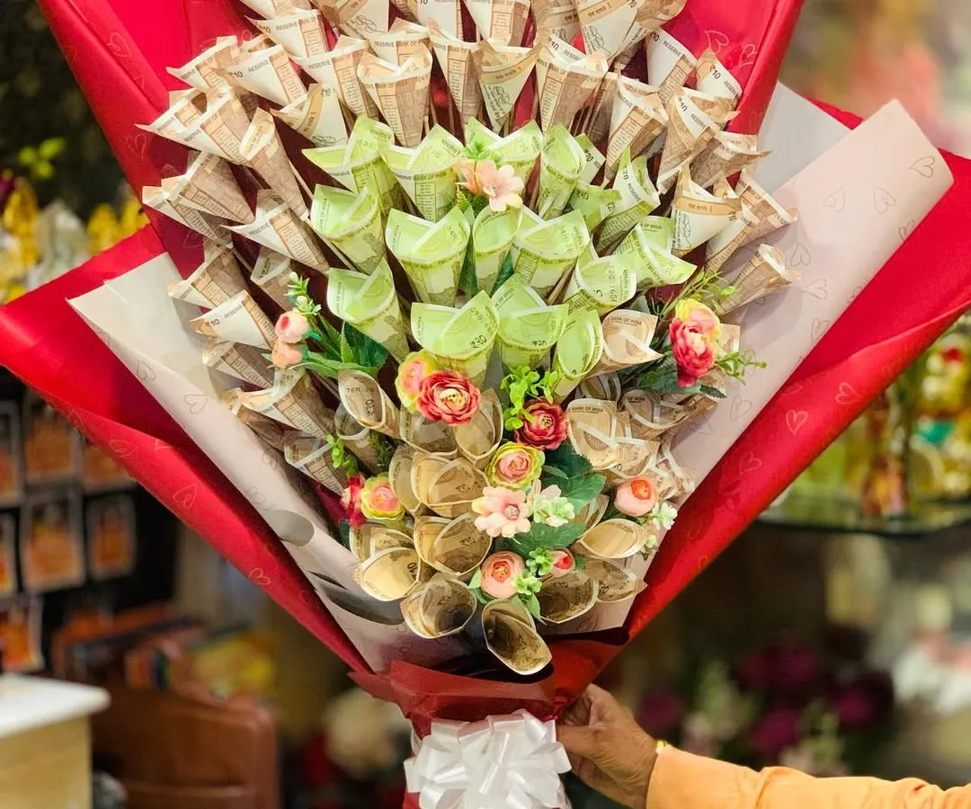 For a truly impressive and practical gift, I design these money bouquets using real Indian currency notes. Each note is carefully folded into a floral shape, creating a stunning arrangement that's very popular for weddings and milestone birthdays.