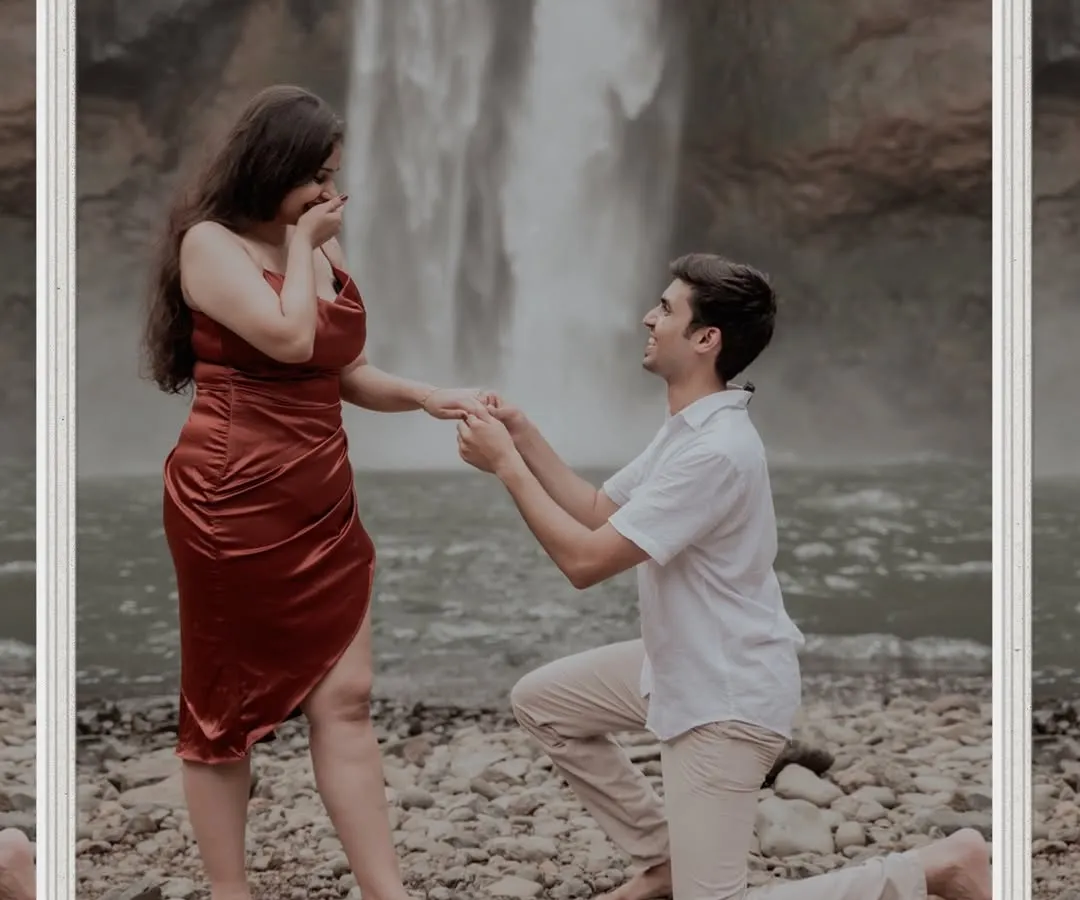 There's something magical about a proposal in nature. Here, against the backdrop of a powerful waterfall, he asked the most important question. This is a perfect example of a surprise proposal in a stunning, natural setting.