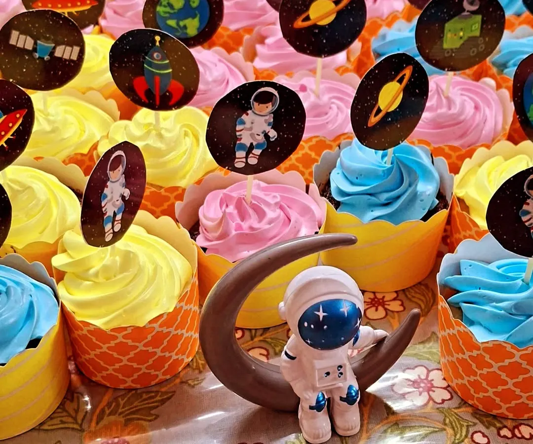 For a child's birthday party, I created this fun batch of space-themed cupcakes. Each one is a soft, eggless vanilla or chocolate cupcake with colorful frosting, topped with edible astronauts, planets, and rockets to create a little galaxy of treats.