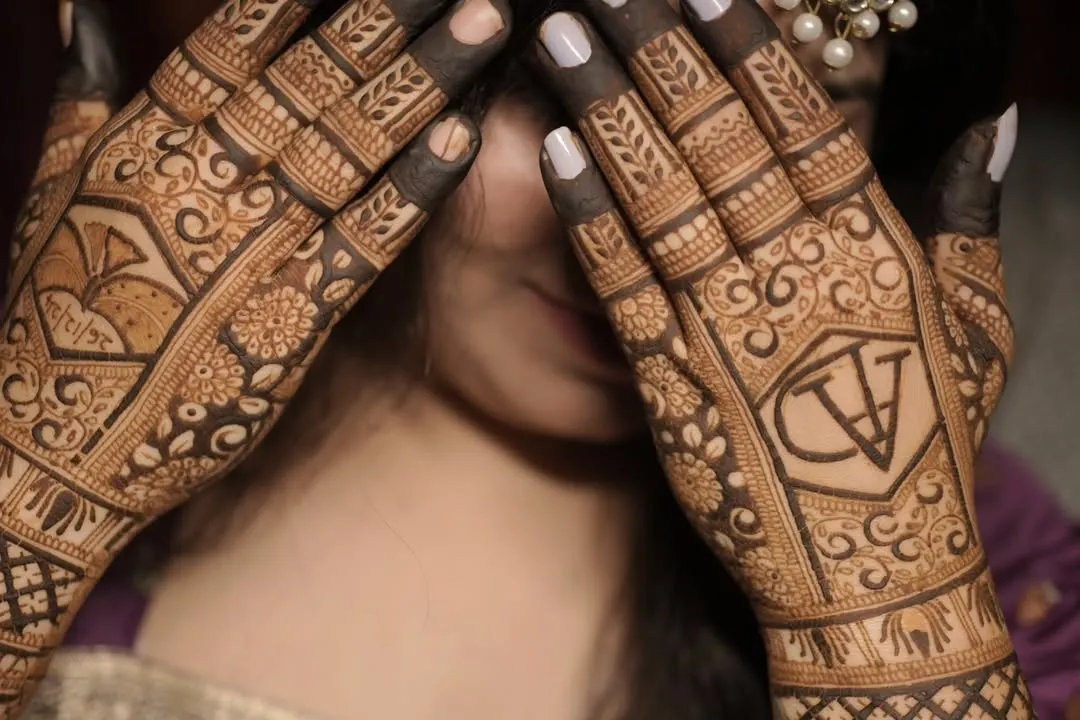 I specialize in personalizing your mehendi. Here, I've woven the couple's initials 'A' and 'V' into a traditional design, making it a unique symbol of their union.
