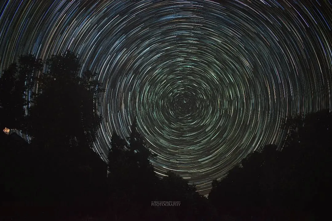 Capturing these star trails over the forests of Chopta meant spending a night in the freezing cold, but it was completely worth it. This is a long exposure photograph, a composite of many shots, that shows the Earth's rotation against the backdrop of the night sky.