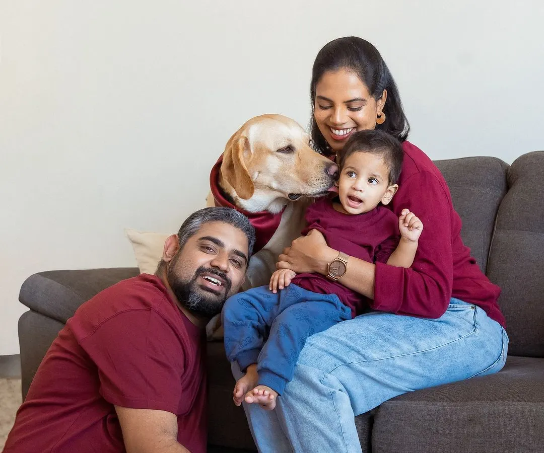 And then there were four. This is the kind of relaxed, love-filled family portrait I live to create, right in the comfort of your own home where everyone, including your furry friend, feels at ease.