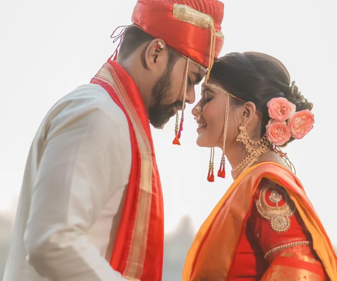 A quiet moment between Pratik and Madhuri on their wedding day. I believe the most powerful emotions are often unspoken. My goal with couple portraits is to capture this authentic connection, creating timeless Maharashtrian wedding photos you'll cherish forever.