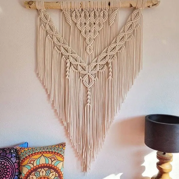 My large bohemian-style wall hangings are designed to be a stunning centerpiece in any room. I use intricate knotting techniques and natural cotton cord to bring a warm, earthy, and artistic feel to your living space.