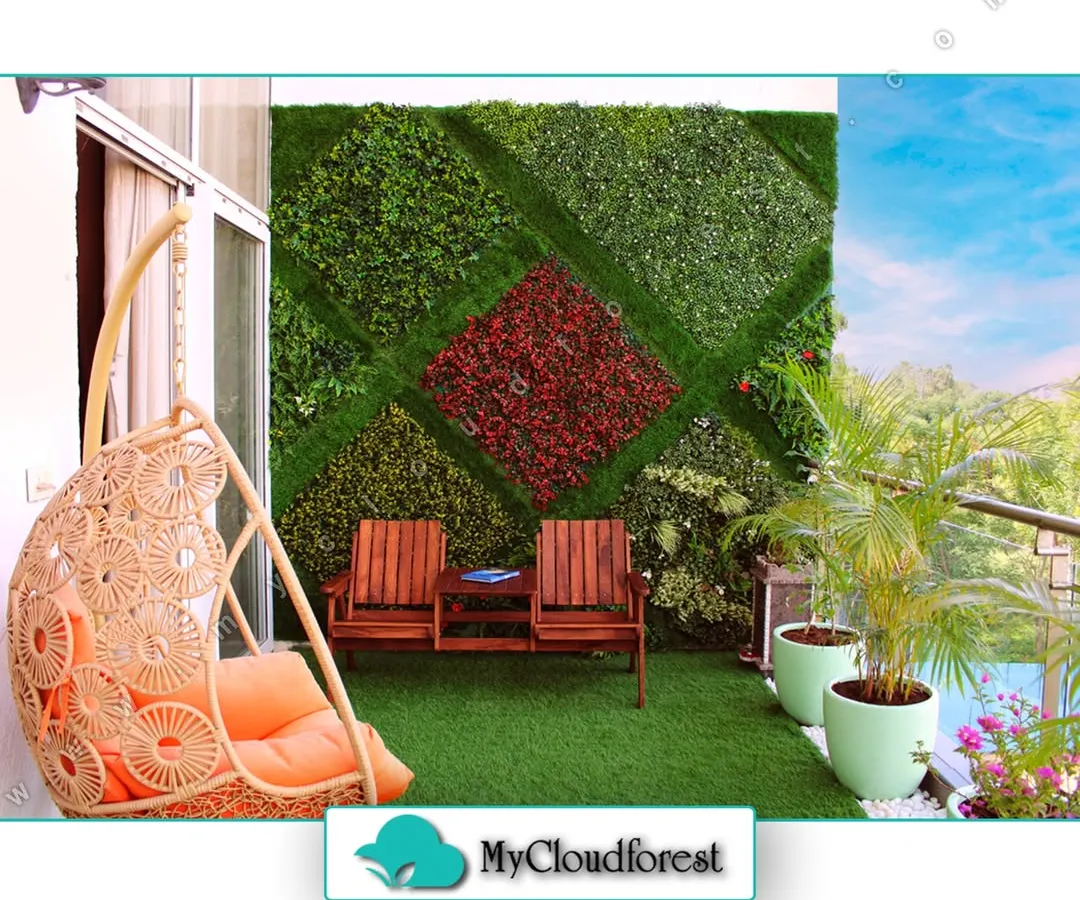 Your personal sky-high retreat awaits. This balcony design combines a comfortable rattan swing chair with a unique, patterned artificial vertical garden, creating a vibrant and playful corner. It proves that even compact spaces can become a lush paradise with a touch of creativity.