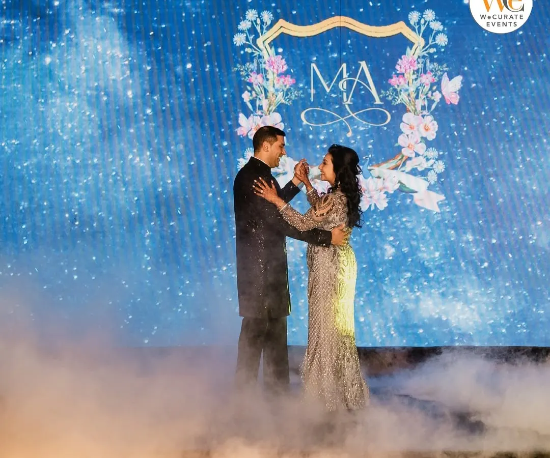 This is what it's all about: the couple sharing their first dance, surrounded by an atmosphere we built just for them. I coordinate everything, including special effects like this low-lying fog, so you can focus on the moment.