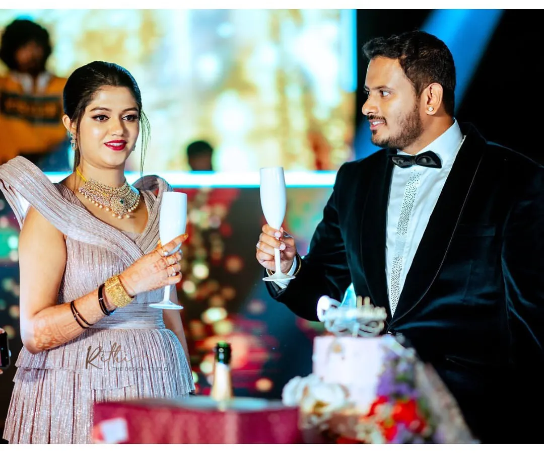 For the cocktail party, we went with a sharp, modern look. This custom-tailored black velvet tuxedo with a classic bow tie is perfect for a celebratory toast and an evening of dancing. It’s a sophisticated choice for any groom's reception or pre-wedding event.