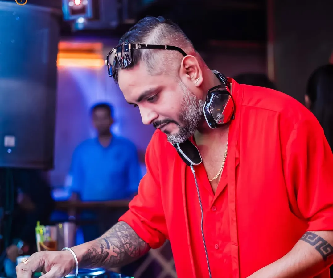 In the zone, crafting the perfect set. Every track is chosen to keep the energy high and the crowd moving. This is a glimpse of me at my console, focused on the mix at The Fixx Bar.