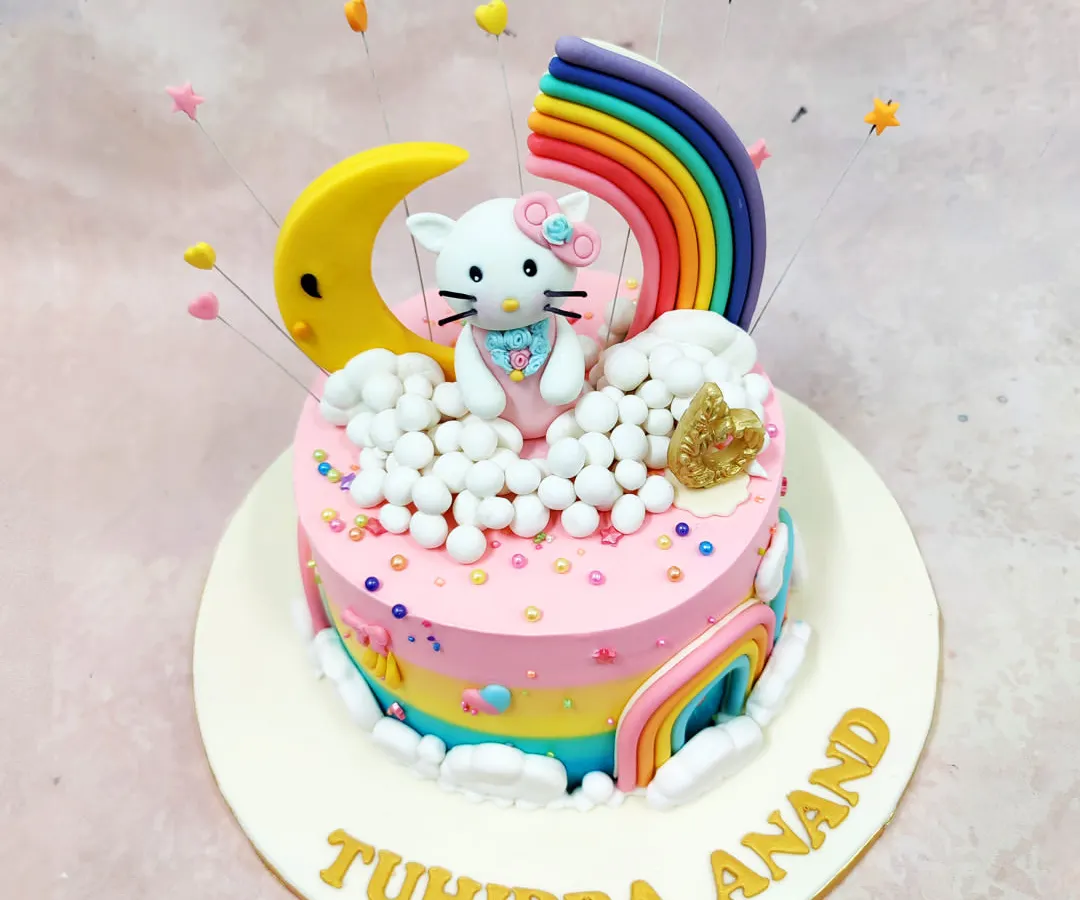 We bring dreams to life with this Hello Kitty Rainbow Cake. This design combines a beloved character with a vibrant, magical world of rainbows, moons, and clouds, demonstrating our skill in creating colorful, multi-element cakes that are a feast for the eyes.
