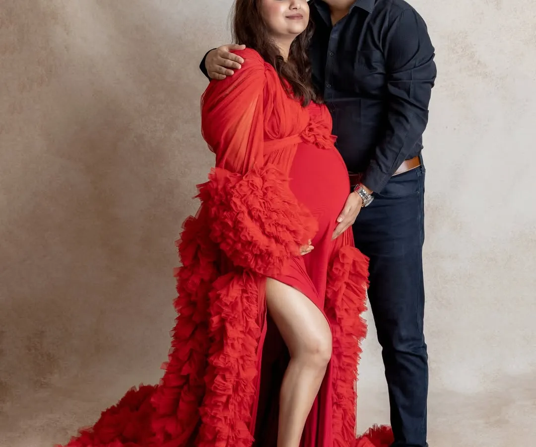 We believe maternity photos are about connection. This tender moment between an expecting couple, captured in our studio, showcases the love and anticipation that makes this time so special.