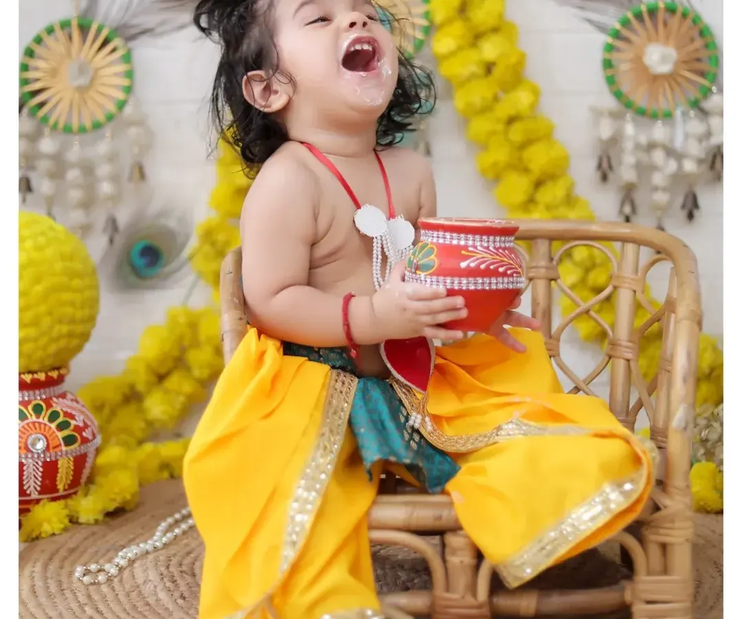 The pure joy of our Janmashtami theme shoot. We love capturing these energetic and happy moments as your little one celebrates, dressed as the playful Lord Krishna.