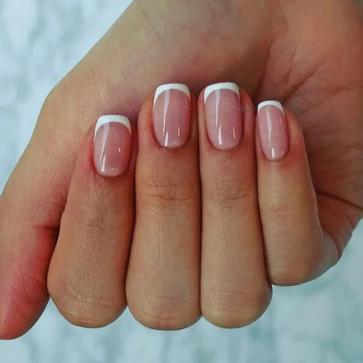 You can never go wrong with a classic French manicure. I shape the nails perfectly and apply the polish with precision for a clean, elegant look that's perfect for any occasion.