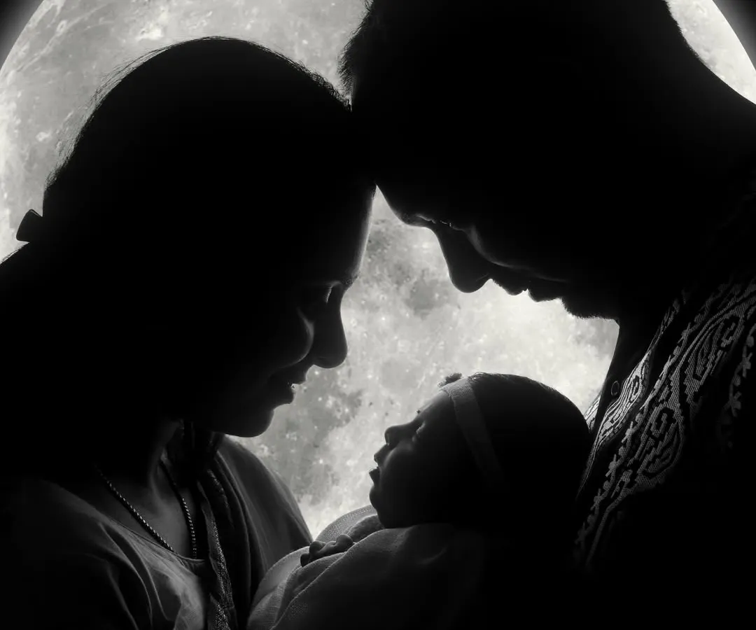 The story continues. We believe in capturing your entire journey, from a couple in love to a family complete. This portrait shows the beautiful moment when two become three, all under the same loving moon.