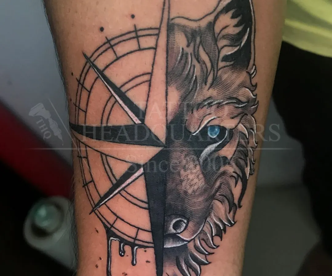 This wolf and compass piece is an example of our black and grey realism work. We focus on capturing sharp details and creating a design that has both meaning and impact.