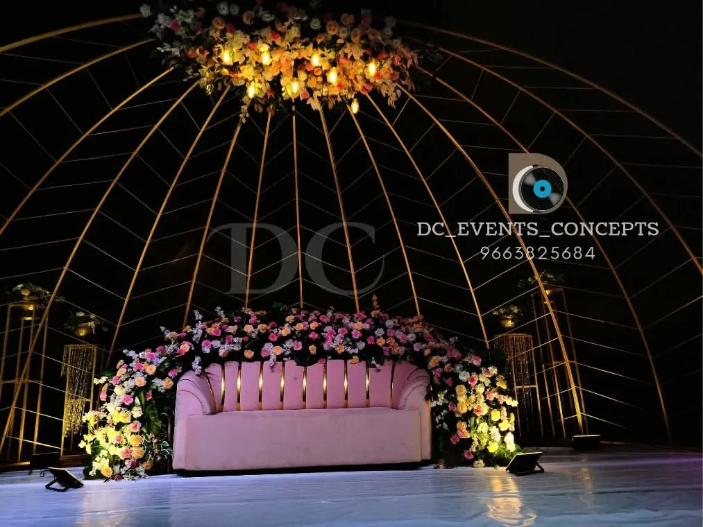 This is one of our signature large scale reception stages. The elegant dome structure, adorned with lush floral arrangements, creates a breathtaking and luxurious focal point for any grand celebration.