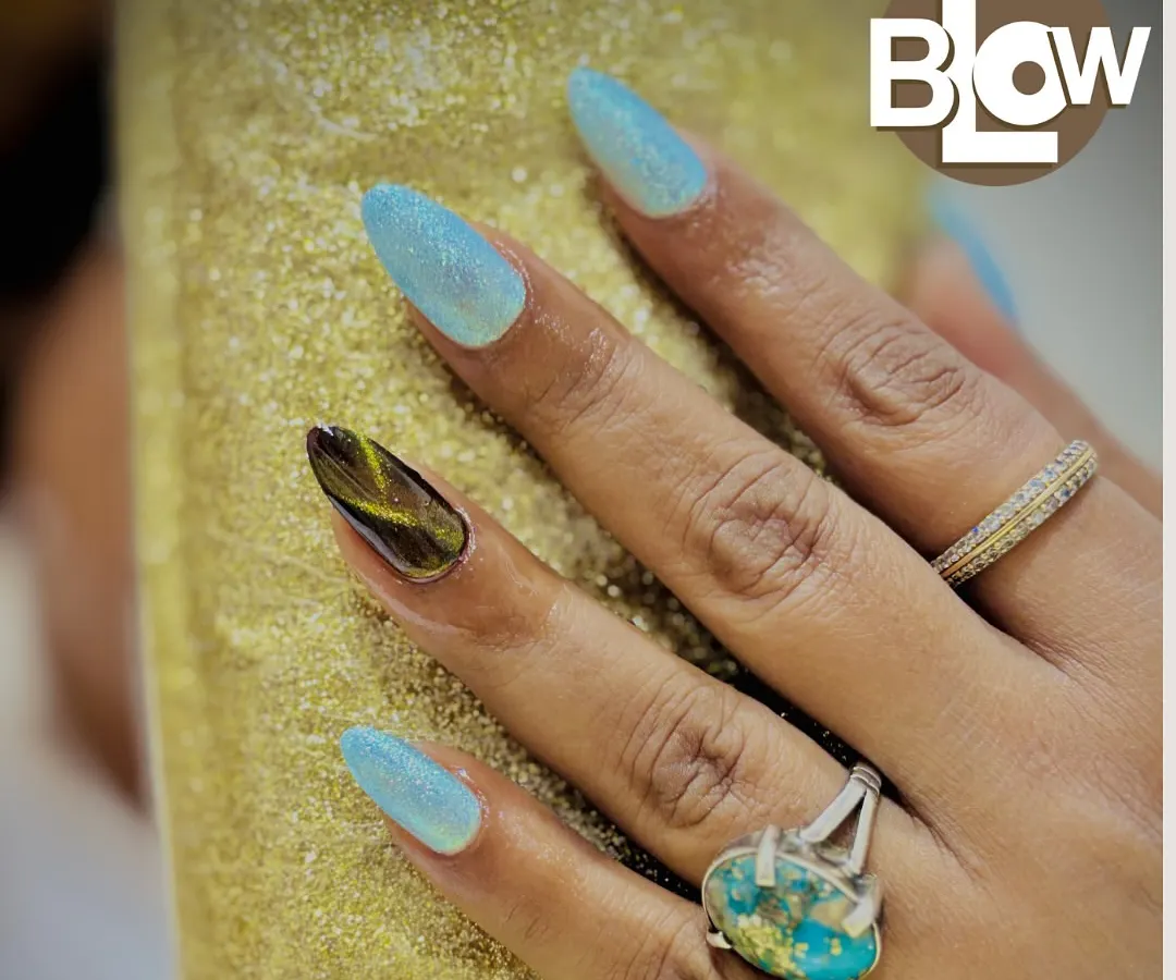 I love creating unique accent nails. Here, I paired a shimmery, light blue polish with a custom, hand-painted tortoiseshell design on the ring finger for a truly one-of-a-kind manicure.
