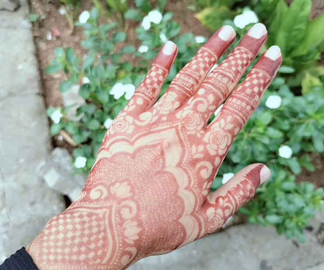 This is the beautiful, rich reddish-brown stain that develops after the henna paste is removed. I only use 100% organic henna that I mix myself to ensure you get this gorgeous, natural, and safe result every time.