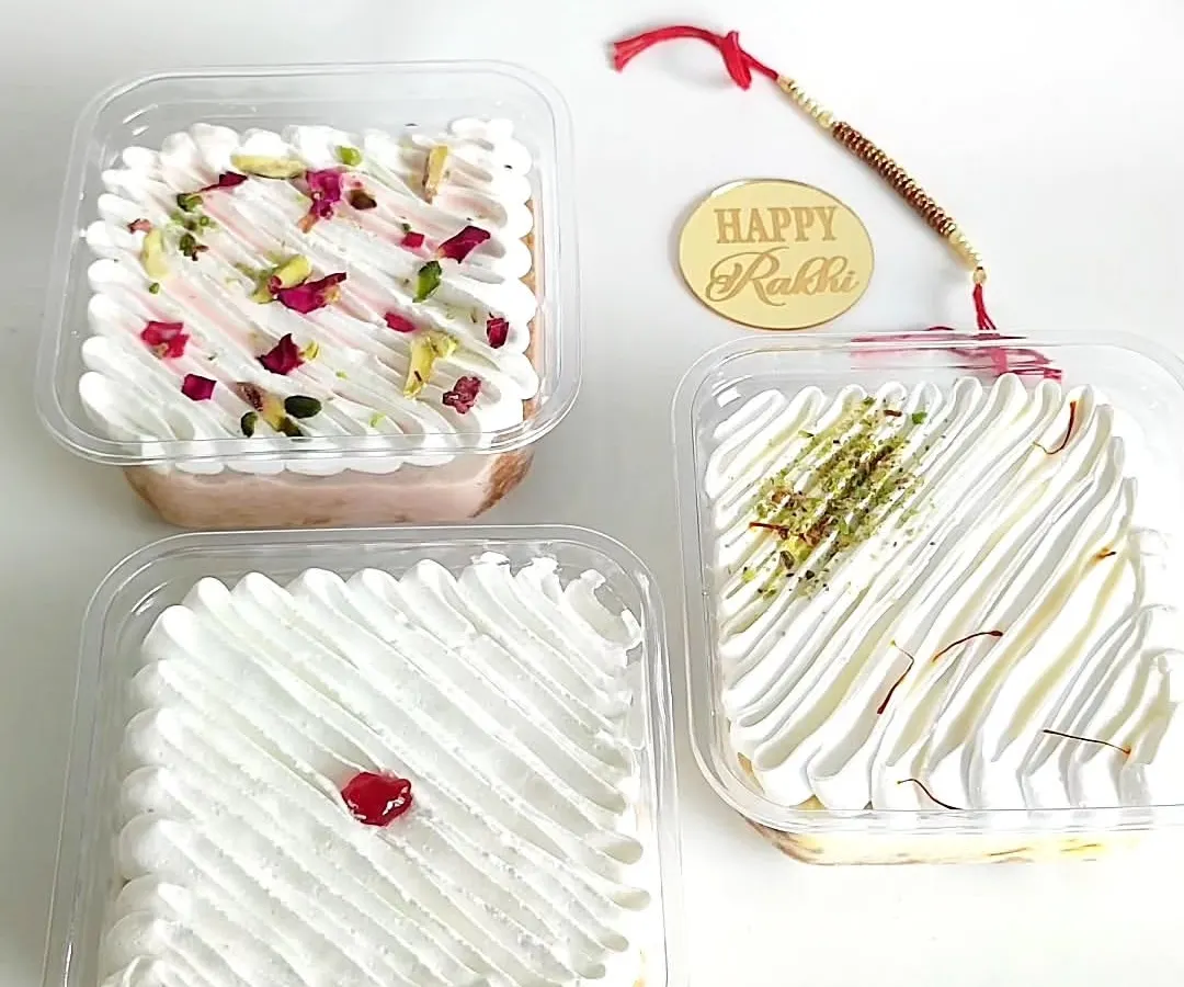 My signature Tres Leches tubs are a true comfort dessert, and here you can see the full range of my fusion flavors. I offer the Classic, a rich Rasmalai version with pista and saffron, and a fragrant Rose flavor that tastes just like falooda.