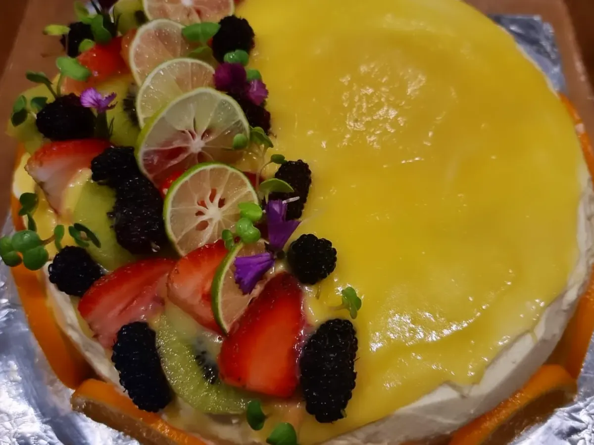 Our chilled cheesecake has kagzi lemon curd across the top, with strawberries, mulberries and kiwi arranged along one side.