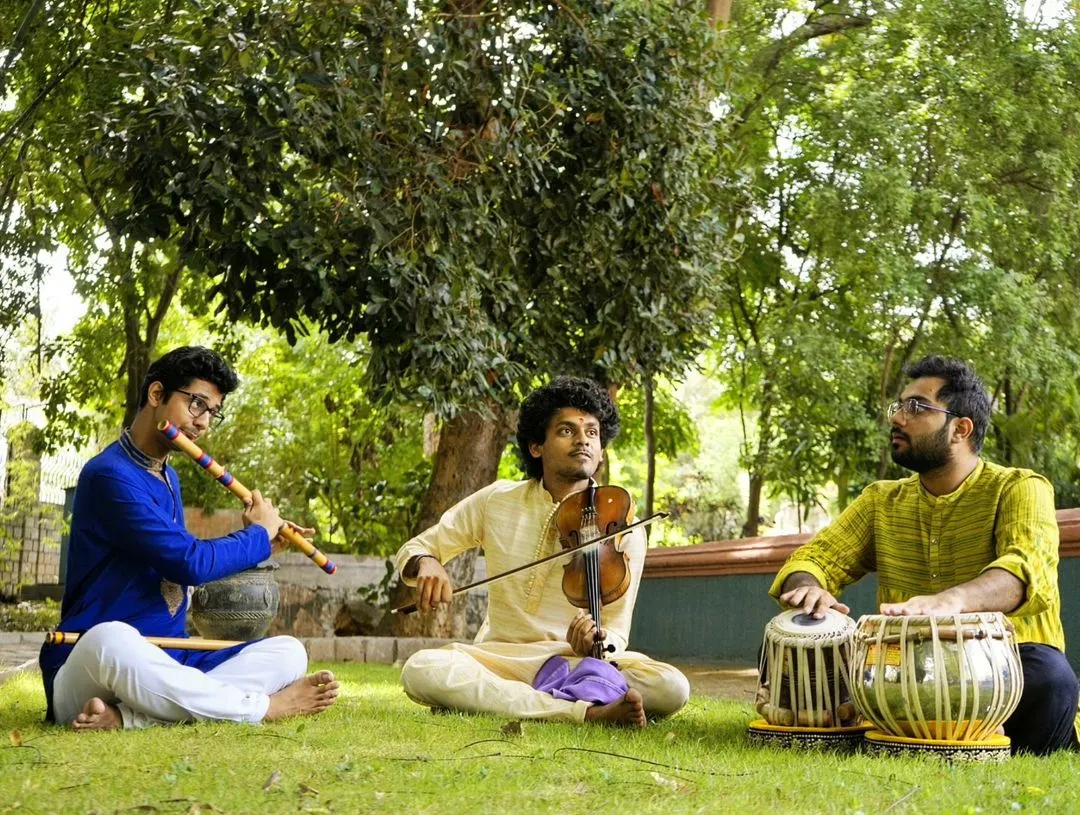 There is a special joy in creating music outdoors with friends. Here I am in a jugalbandi session with Hrishikesh Majumdar on violin and Sumanth Manjunath on flute, blending our instruments together in a beautiful natural setting.