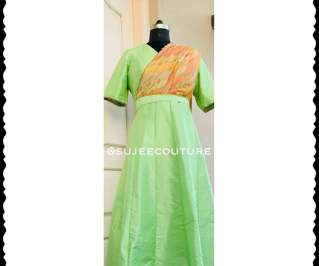 This full-length view shows a custom-made long gown in a lovely light green silk. I designed this piece with an attached, pre-draped dupatta in a contrasting print, so your little one gets a sophisticated look without any fuss. It’s a perfect example of a comfortable, one-piece occasion wear outfit.