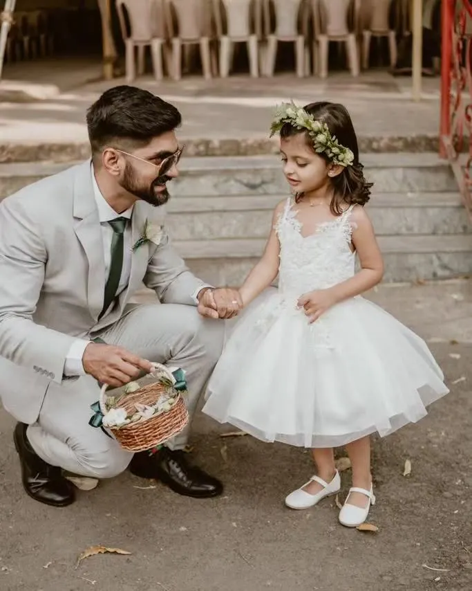 A perfect moment for a little flower girl. I crafted this classic white tulle gown to be both elegant for the ceremony and comfortable enough for her to feel like a cherished part of the special day.