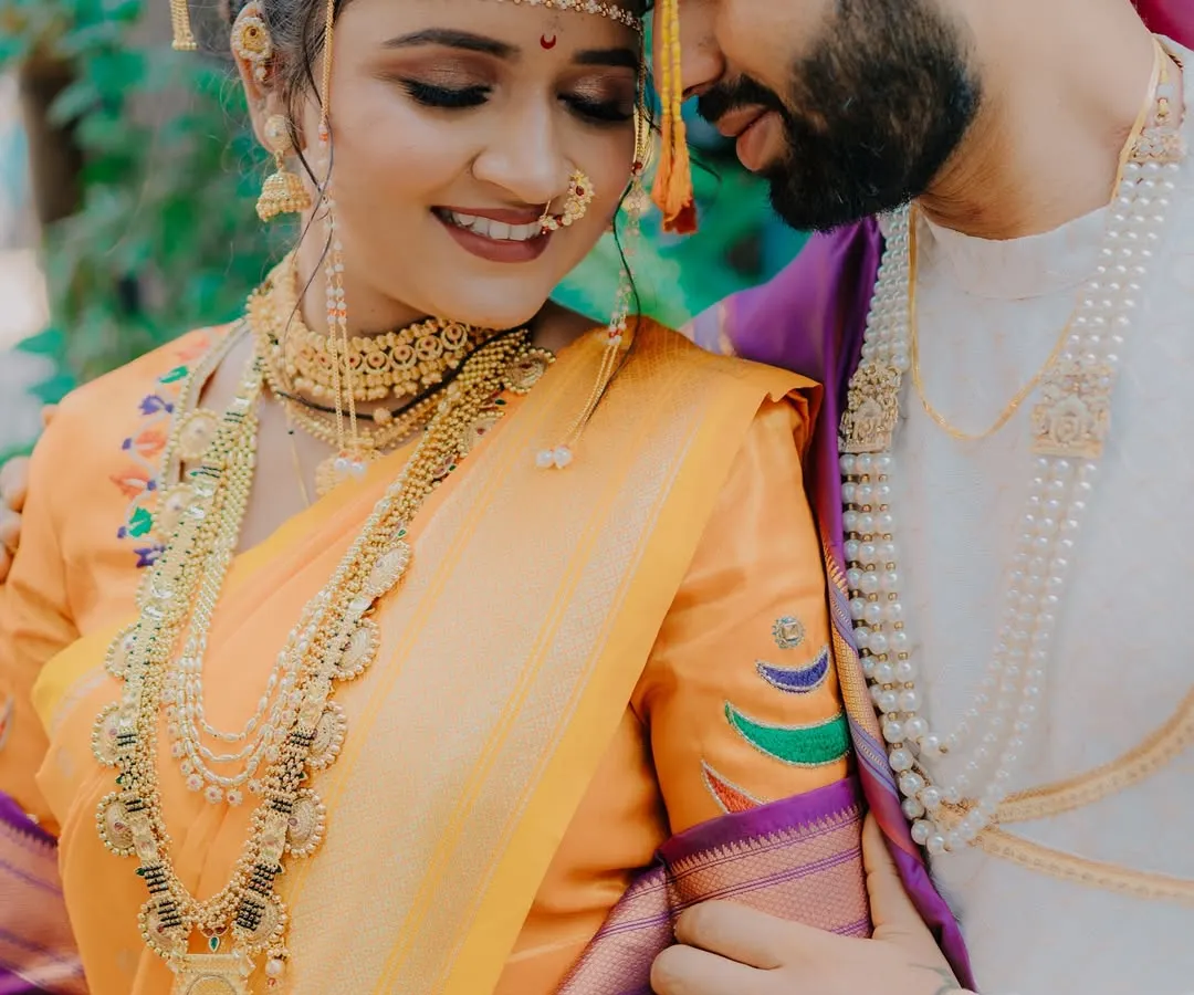 This is the kind of moment I live to capture. An intimate, unposed portrait of a Maharashtrian couple, lost in their own world. The delicate mundavalya and traditional jewelry complete the frame.