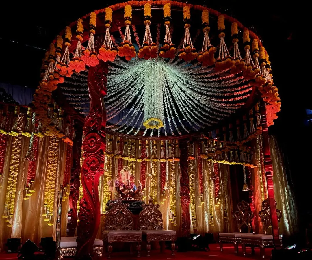For Ganesh Chaturthi, I designed this magnificent circular mandap. The canopy is made of thousands of hanging jasmine and tuberose strings, creating a divine atmosphere for Bappa.