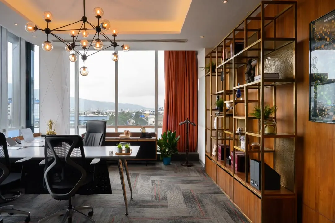 An executive cabin should feel powerful and inspiring. I designed this space with a stunning view, a bold sputnik chandelier, and a custom gold-finished shelving unit that adds a touch of luxury without being stuffy. It’s a workspace that makes a statement.