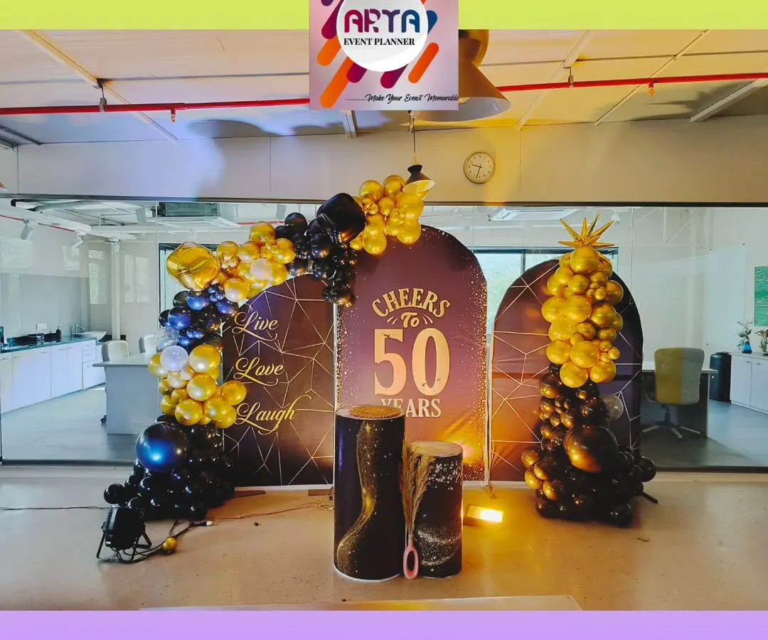For the 50th anniversary of Paras Defence in MIDC Nerul, we created this celebratory photo corner right inside their office. The setup features custom backdrops and elegant black and gold balloon arrangements to mark the corporate milestone.