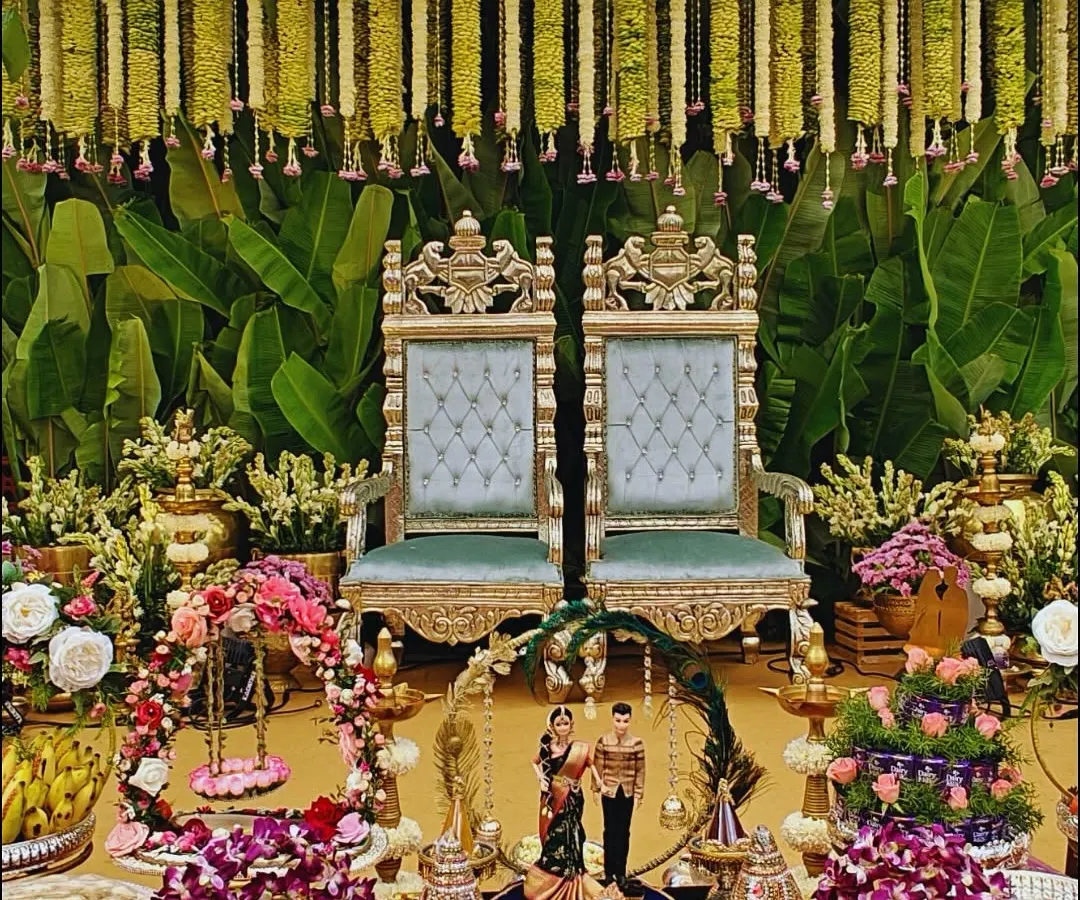 A beautiful, traditional setup for a South Indian ceremony, rich with detail. We combined ornate golden chairs, fresh floral arrangements, brass lamps, and offerings to create a sacred and picturesque space for the couple.