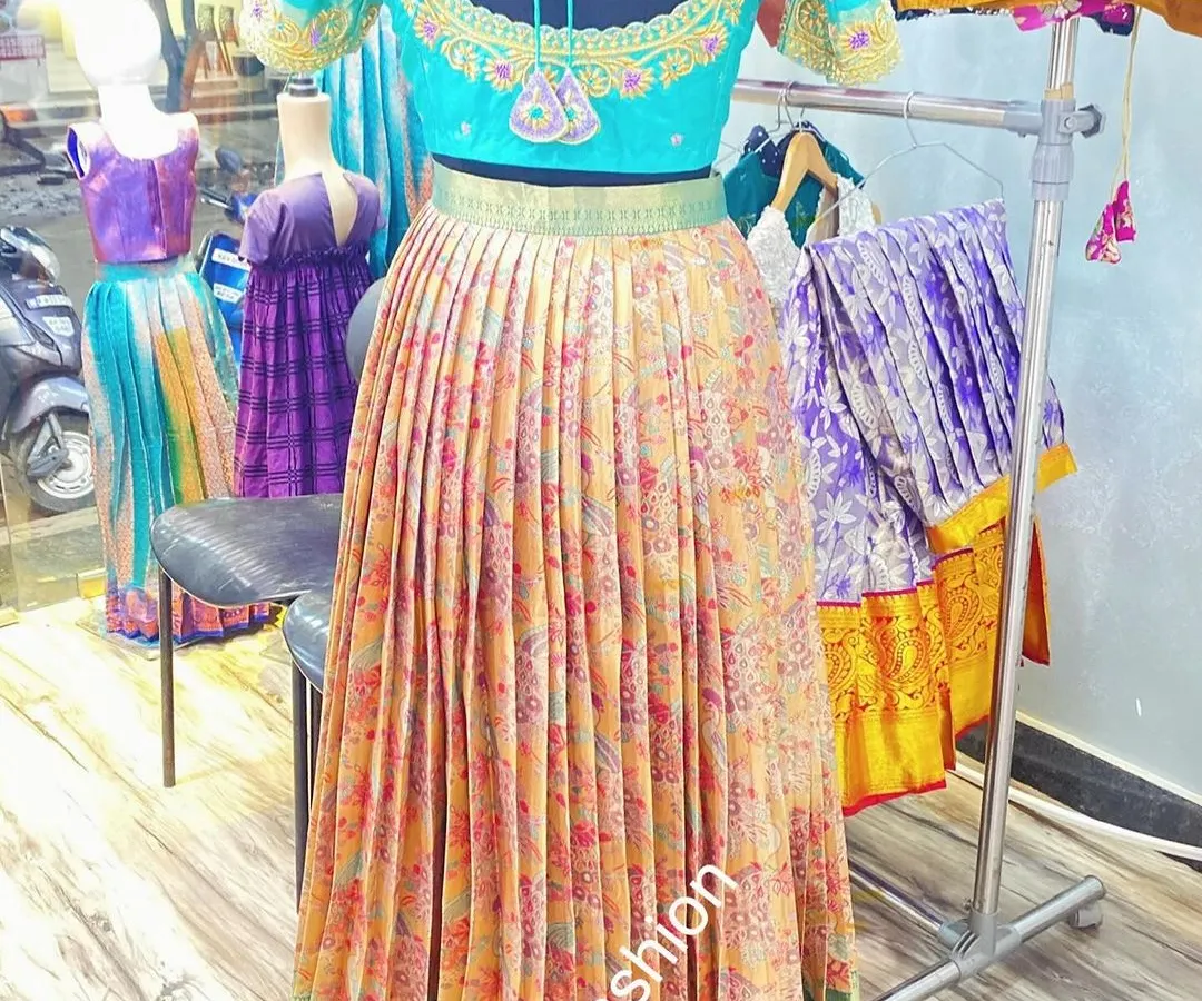 This vibrant lehenga set was created from a single floral saree. I used the body for the pleated skirt and designed a custom embroidered blouse to match.