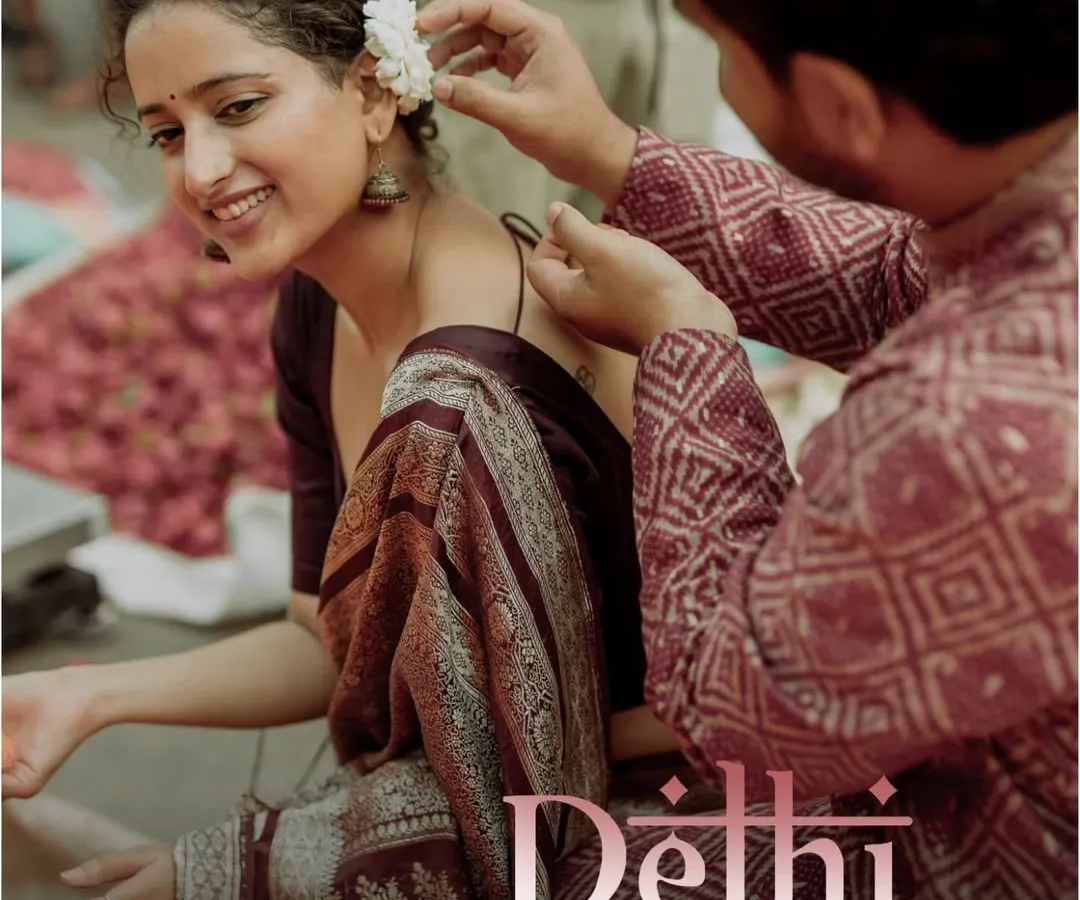 This is what a themed shoot in Old Delhi feels like. I captured this quiet, tender moment as he placed a flower in her hair, surrounded by the authentic hustle of the city. It’s these small, unscripted interactions that truly tell your story, turning a photoshoot into a cherished memory.