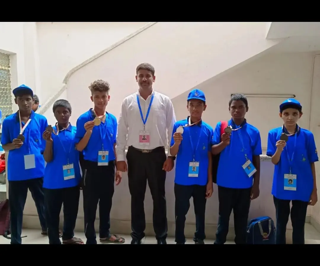 I am very proud to stand with my junior boxing team after their success at the Karnataka Mini Olympics. We train them for discipline and results, and their medals show the hard work we put in together.