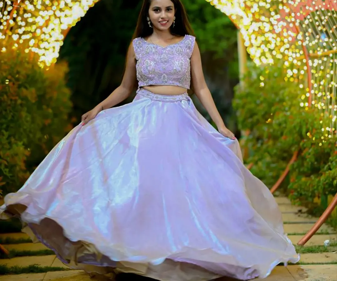 A beautiful shot of our iridescent lavender lehenga, perfect for a pre-wedding event or sangeet. The flowing skirt is designed to create a magical twirling effect in photos and videos.