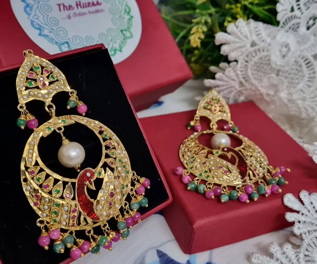 Meet my मोर चंदबाली (Peacock Chandbali). These gold-plated Jadau earrings feature a detailed peacock motif with colourful stones, making them a true statement piece for any celebration.