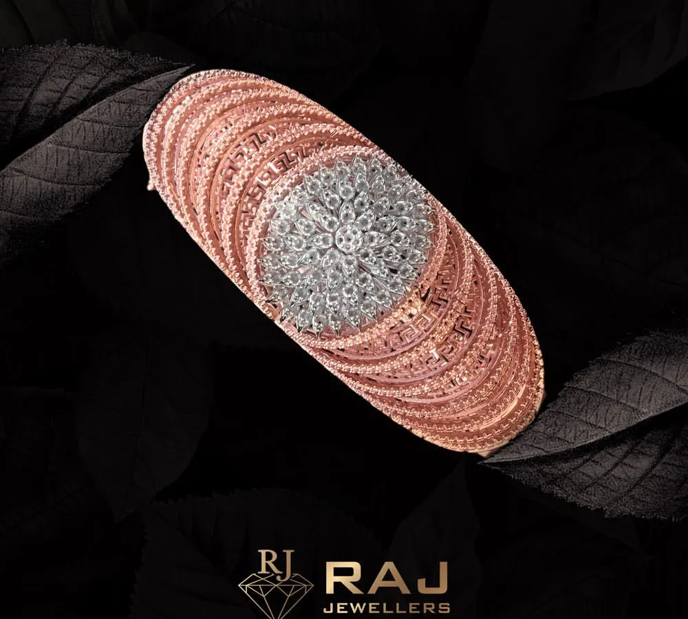 A testament to modern luxury, this rose gold bracelet features a stunning centerpiece of clustered CZ stones, creating a brilliant floral effect. The intricate design and warm tones make it a sophisticated statement of style.