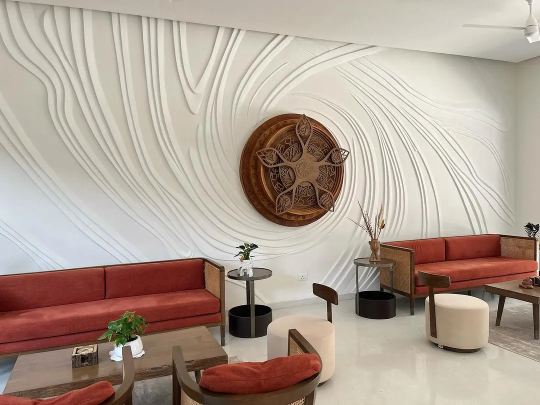 This is what we mean when we say walls have stories. We sculpted this large scale relief mural directly onto the wall, creating a flowing, textured surface that interacts with the room's light and shadows throughout the day.