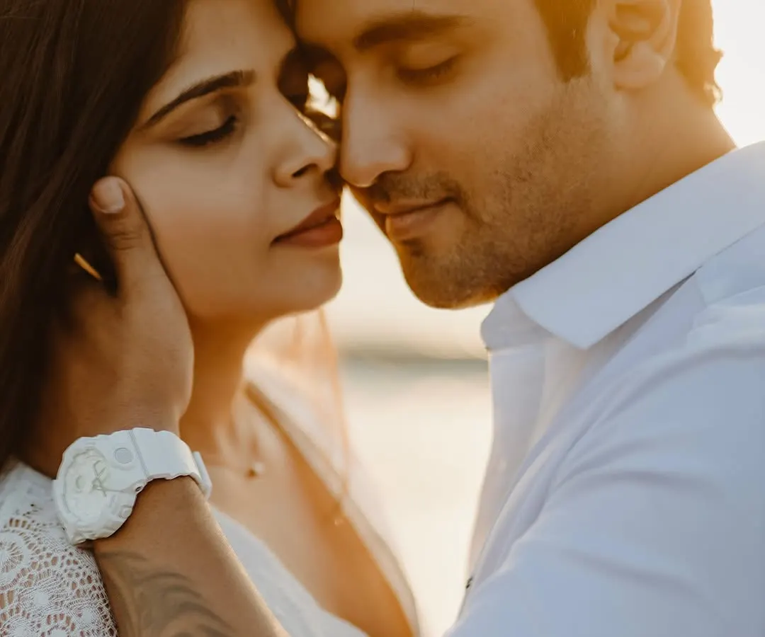 In the warm embrace of the golden hour, a moment of pure, quiet connection. This intimate close-up captures the gentle touch and serene love that I strive to find in every pre-wedding beach shoot.