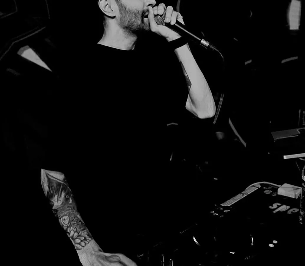 It's not just about playing music; it's about connecting with the crowd. Here I am on the microphone, hyping everyone up and making sure the energy never drops. This is a key part of my live performance style.
