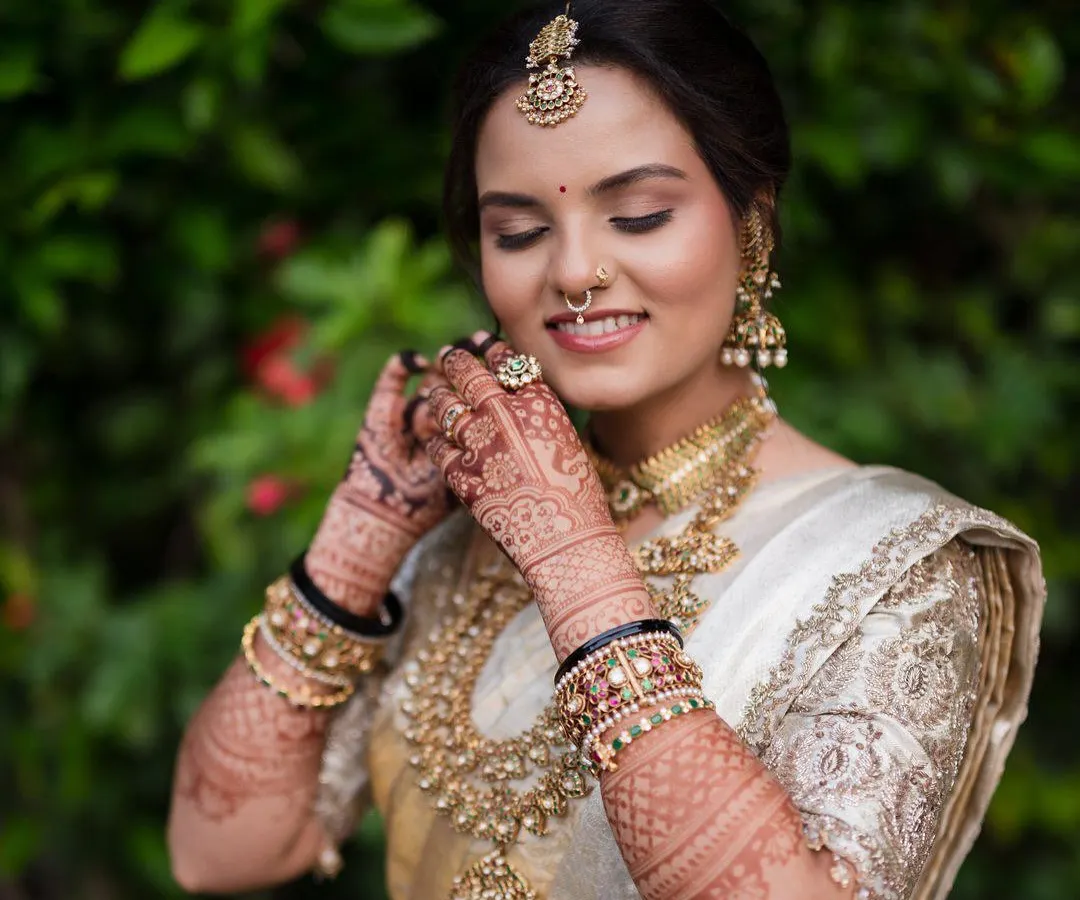 The final look is everything. Here you can see how the rich henna stain complements the bride's stunning wedding attire, adding a layer of tradition and elegance to her special day.