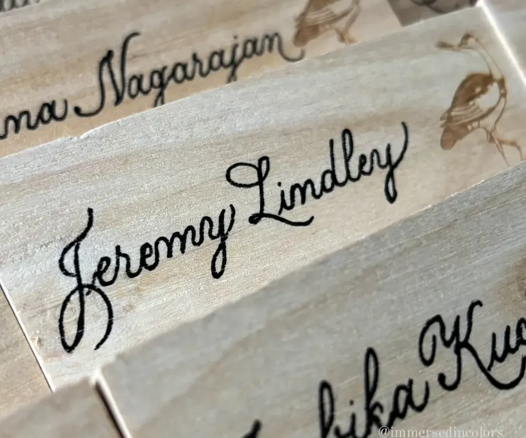A close-up of a custom wooden nameplate I created for Diageo's Godawan. Working on unique surfaces like this rustic wood is a challenge I love, adding a tangible, handcrafted feel to brand merchandise.