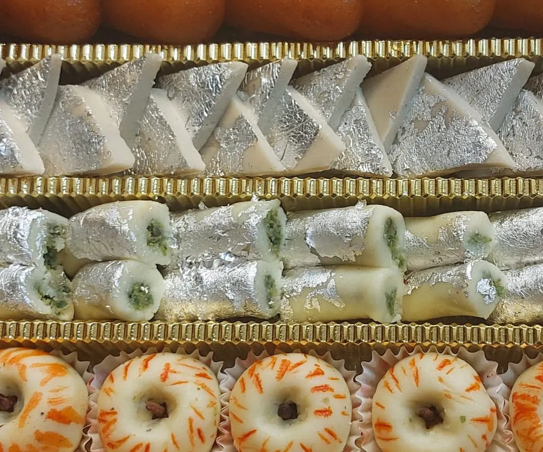 This assorted mithai box is a celebration in itself. It features a beautiful arrangement of our handmade sweets, including Kaju Katli, Pista Rolls, and fruit-inspired sandesh. We prepare these boxes for festivals and special orders, ensuring every piece is fresh and made with pure ingredients.