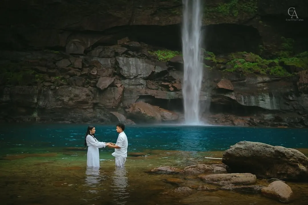 There is a special magic where water meets stone. For this adventurous pre-wedding shoot, we waded into the turquoise pool of a secluded waterfall, capturing a quiet promise in a place of immense natural power.