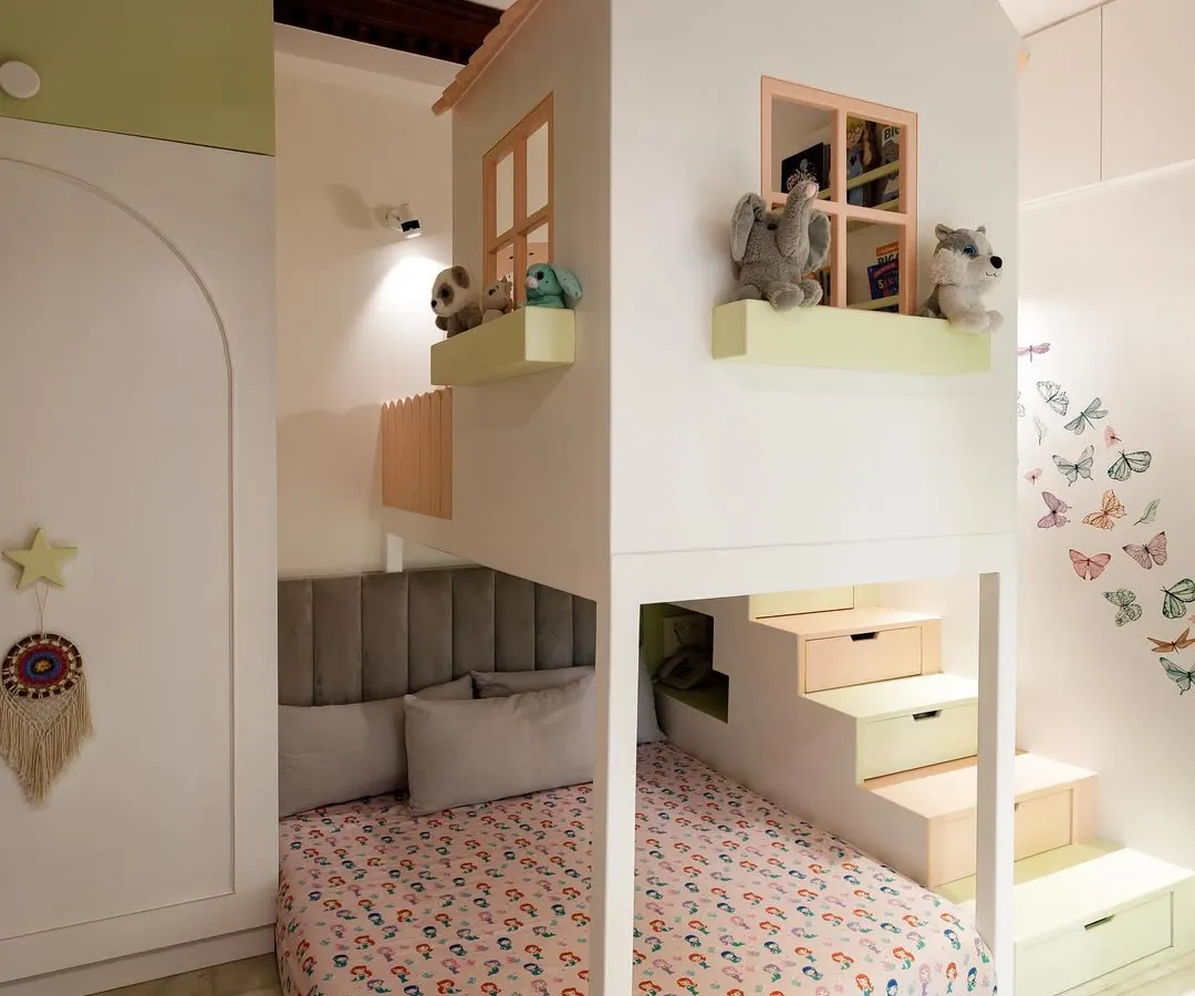 I believe in making every inch of a room count, especially for growing toddlers. This custom house-shaped bunk bed creates a cozy sleeping area below and a playful nook above, all wrapped in a dreamy pastel palette.